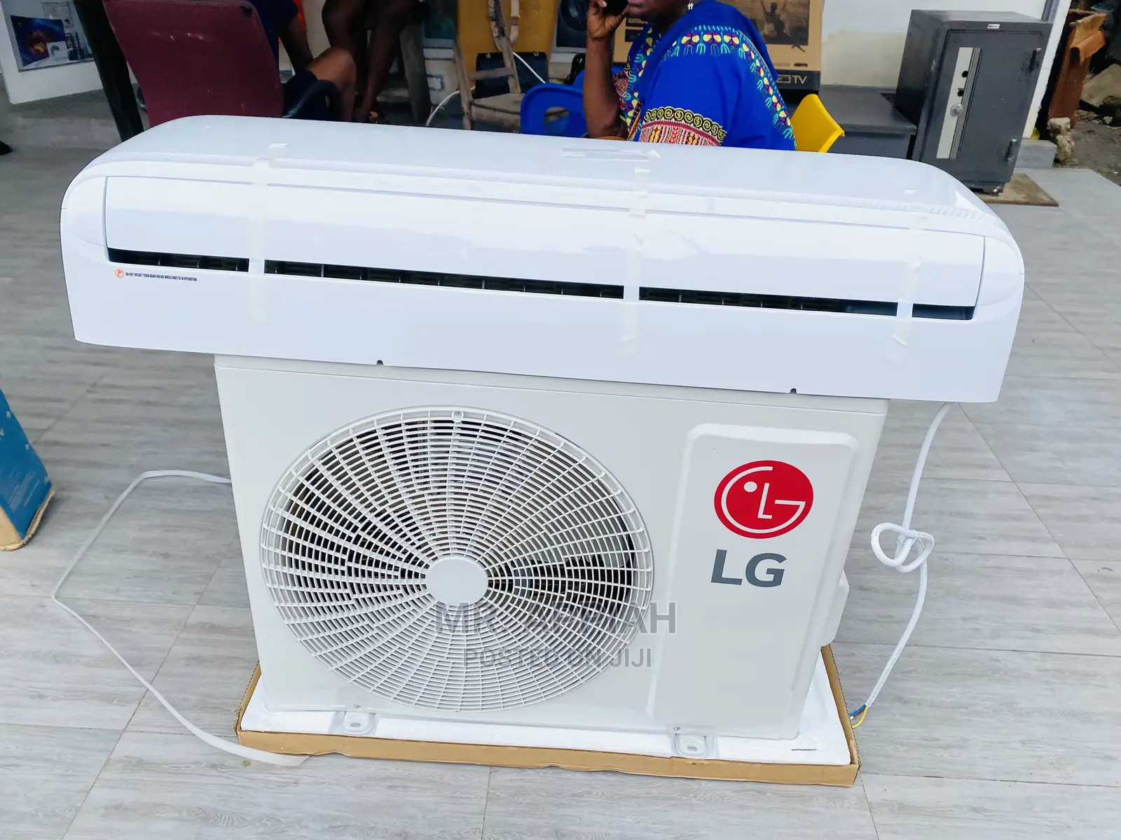 Elegant White LG 2.0HP R410 Air Conditioner On Display.