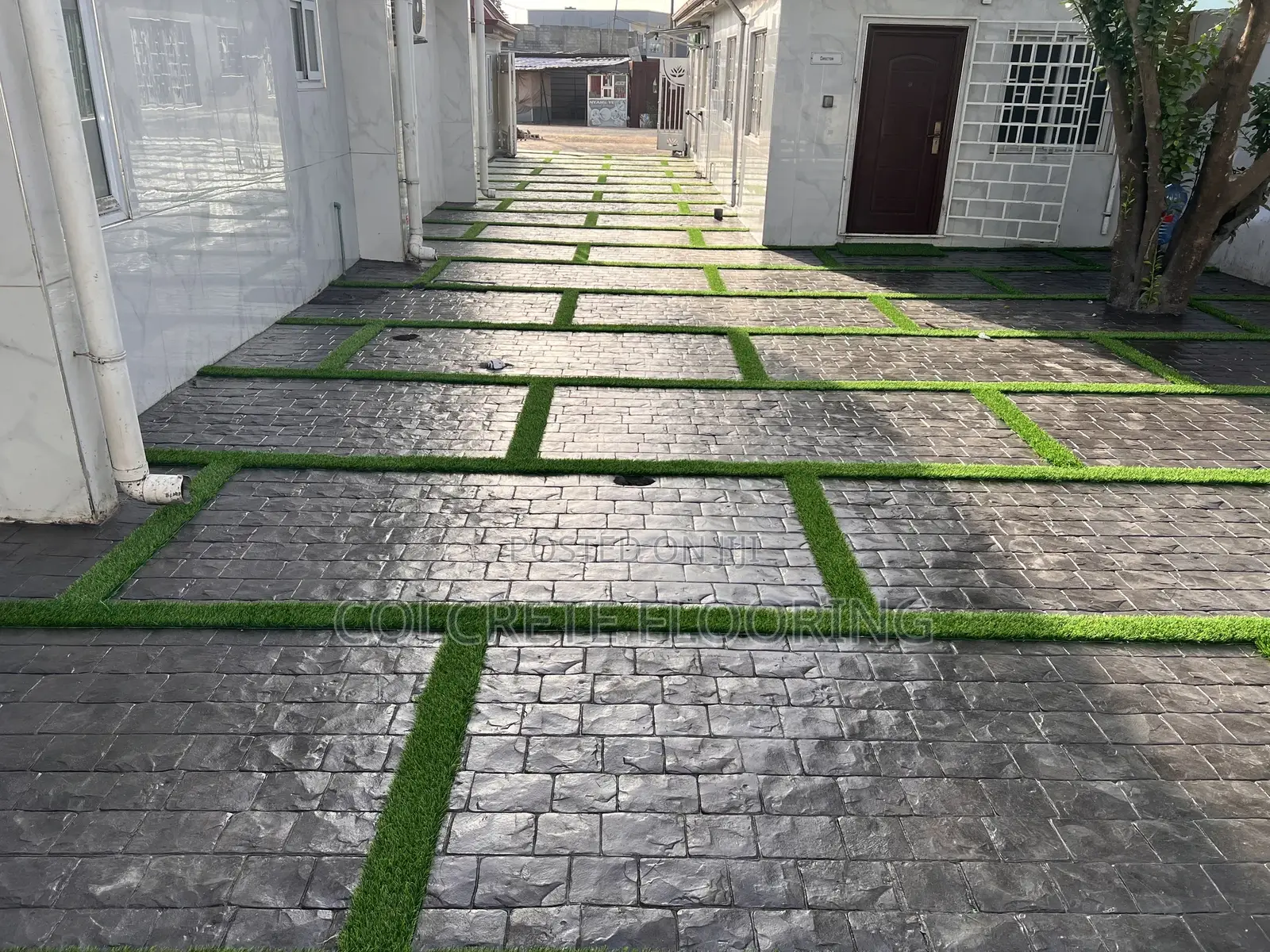 Cobbles Stamped Concrete With Astroturf