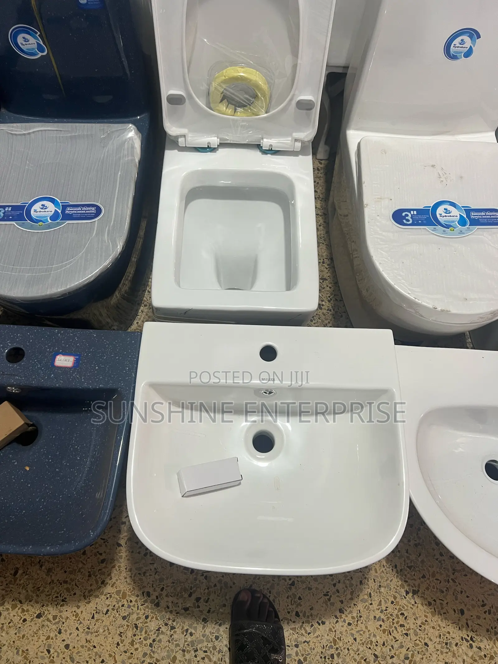 White And Gold Water Closet With Wall Hanging Basin