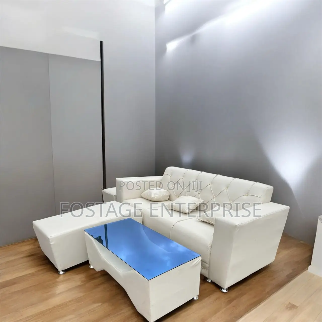Neatly Designed Duarble Sofa With a Centre Glass Table