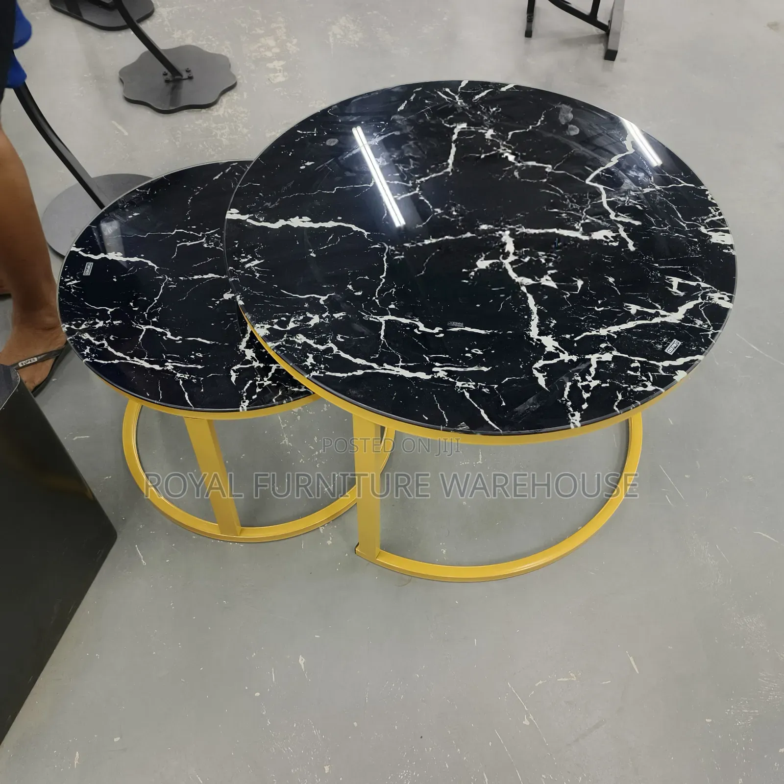 Modern Black Glass Nesting Coffee Tables With Gold Metal Frames.