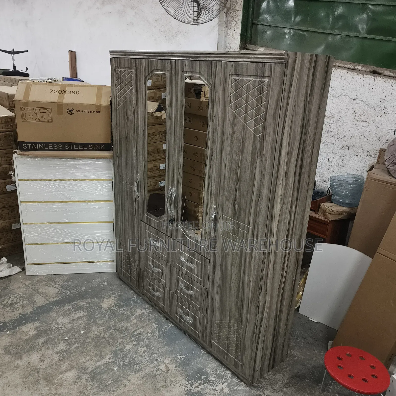 Four-Door Wooden Wardrobe With a Gray Wood Grain Finish.