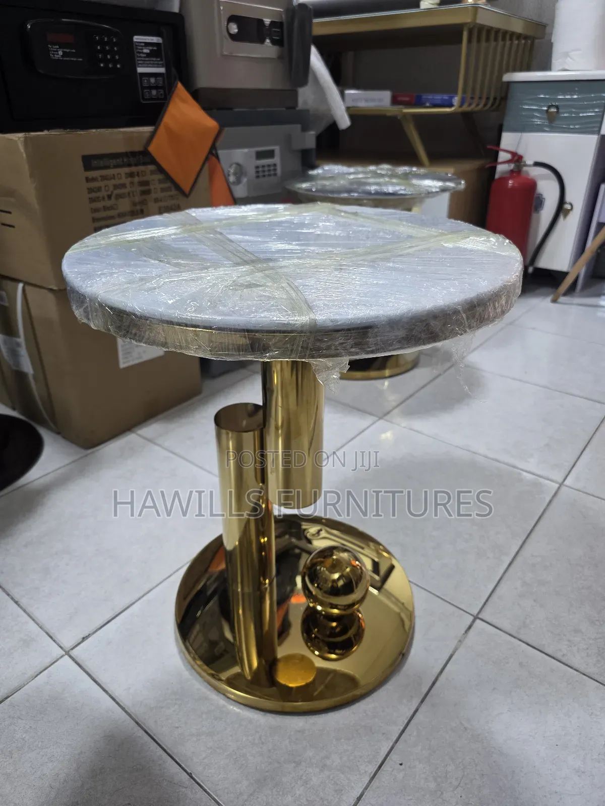 Gold-Finished Round Side Table With a Marble Top.