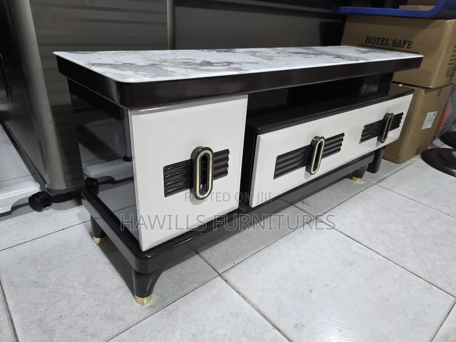 Tv Stand Featuring Gold Accents