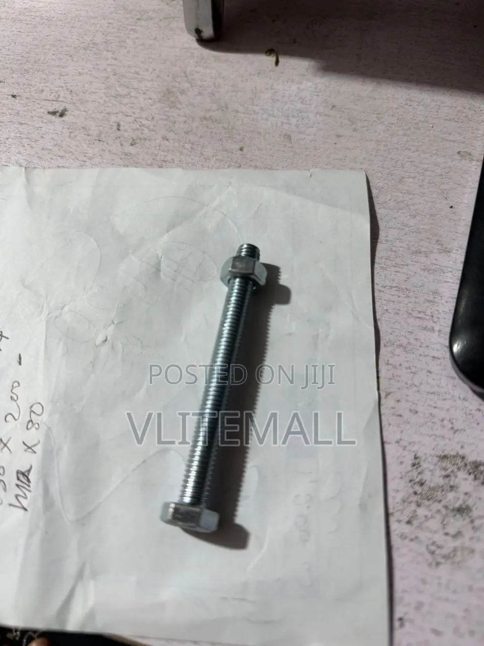 M8 X 80 Hex Bolt With a Corresponding Nut.