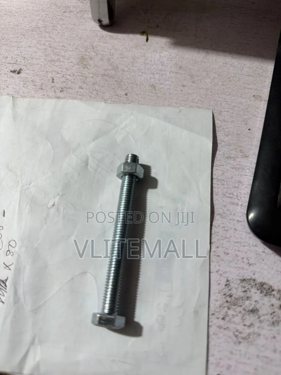 M8 X 80 Hex Bolt With a Corresponding Nut.
