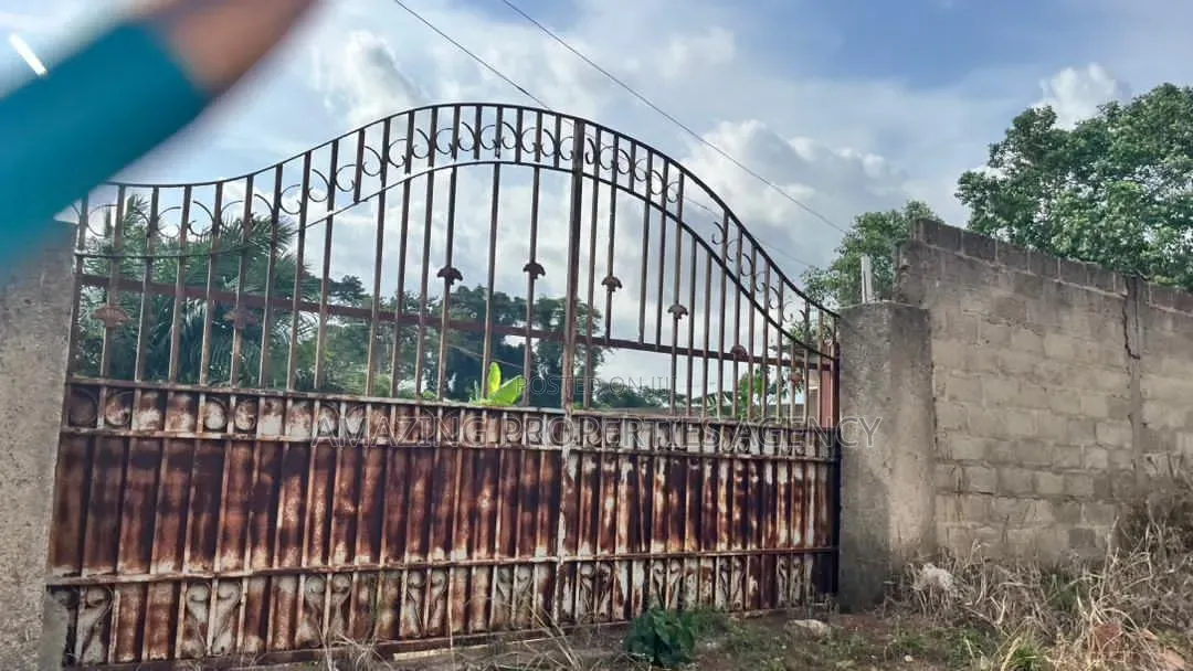 14 Plots Fully Documented Walled Gated Property at Aburi