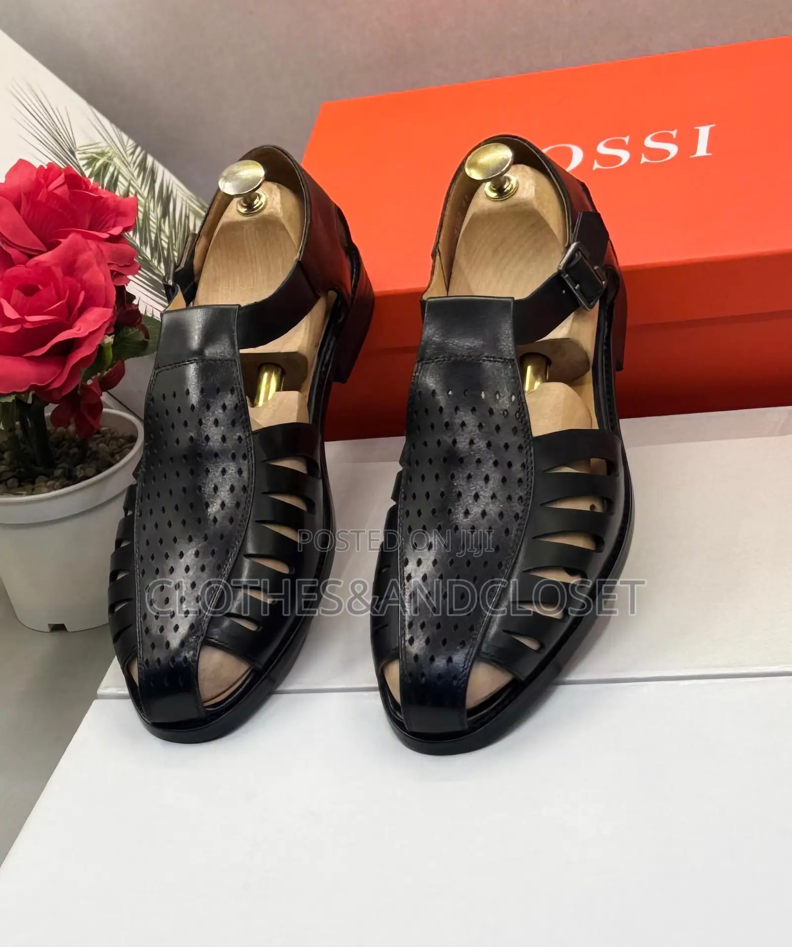 Black Leather Sandals Feature a T-Strap Design
