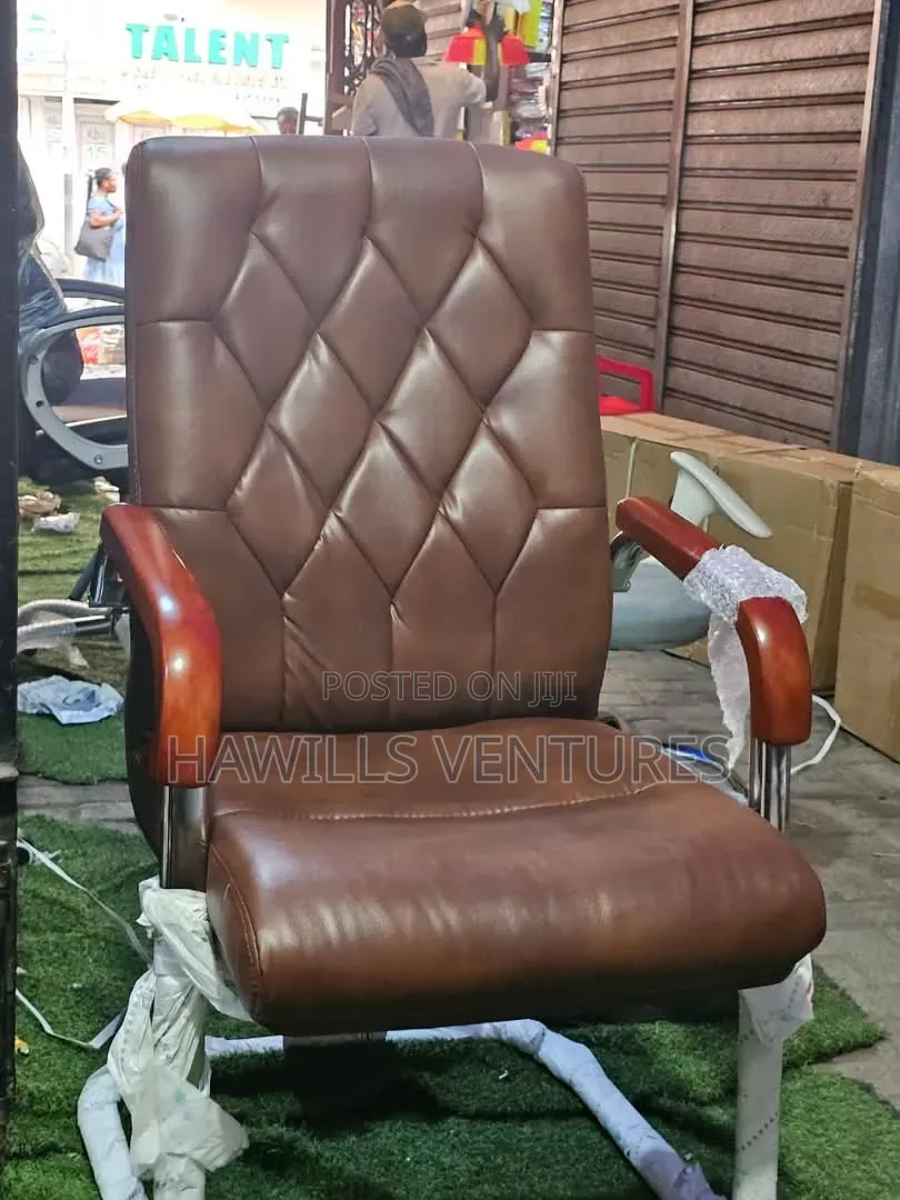 Brown Leather Executive Chair With Wooden Armrests and Slede Base