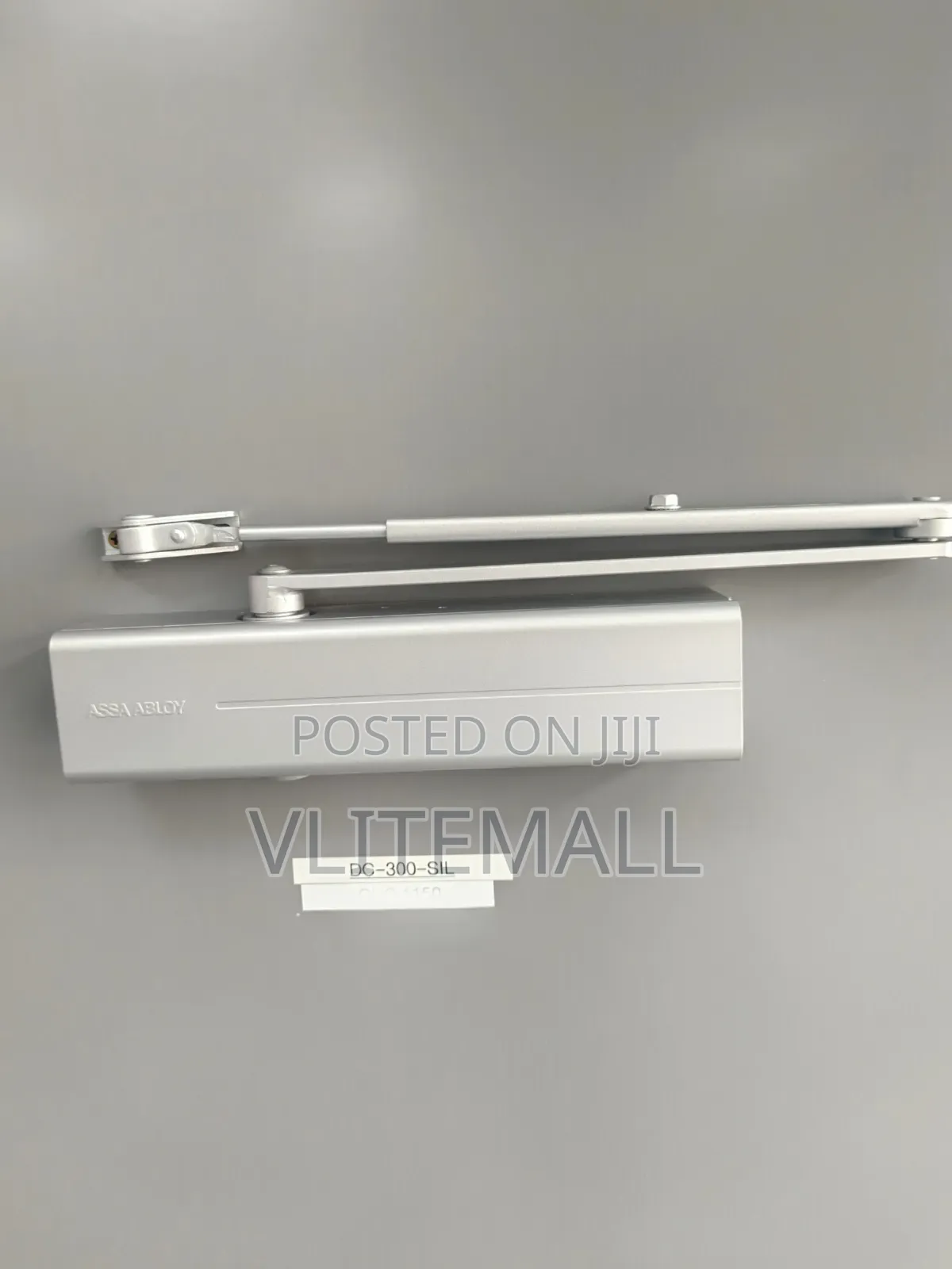 Assa Abloy Surface-Mounted Door Closer, Featuring a Silver Finish