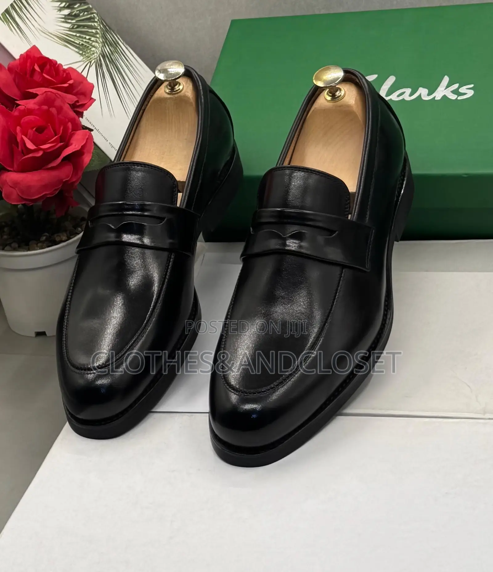 Clarks Black Leather Penny Loafers Featuring a Classic Slip-on Design