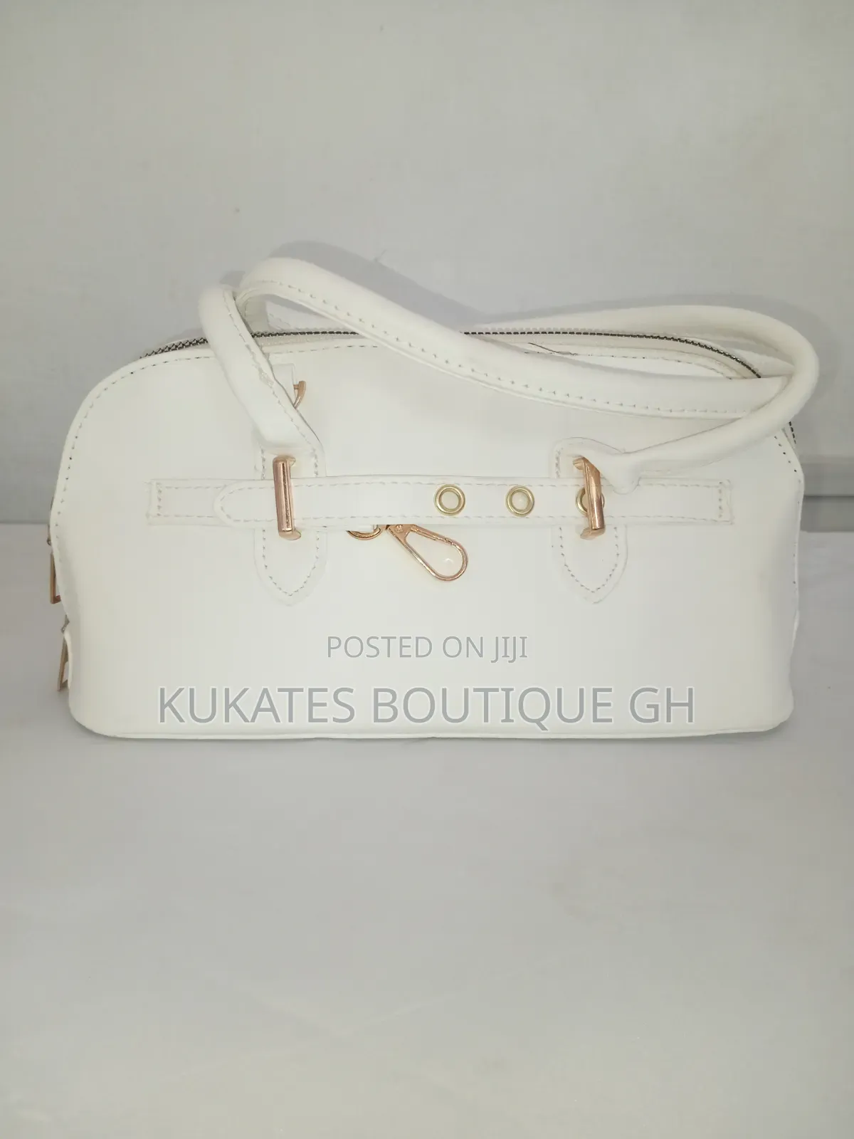 Elegant White Structured Top Handle Handbag With Gold Hardware