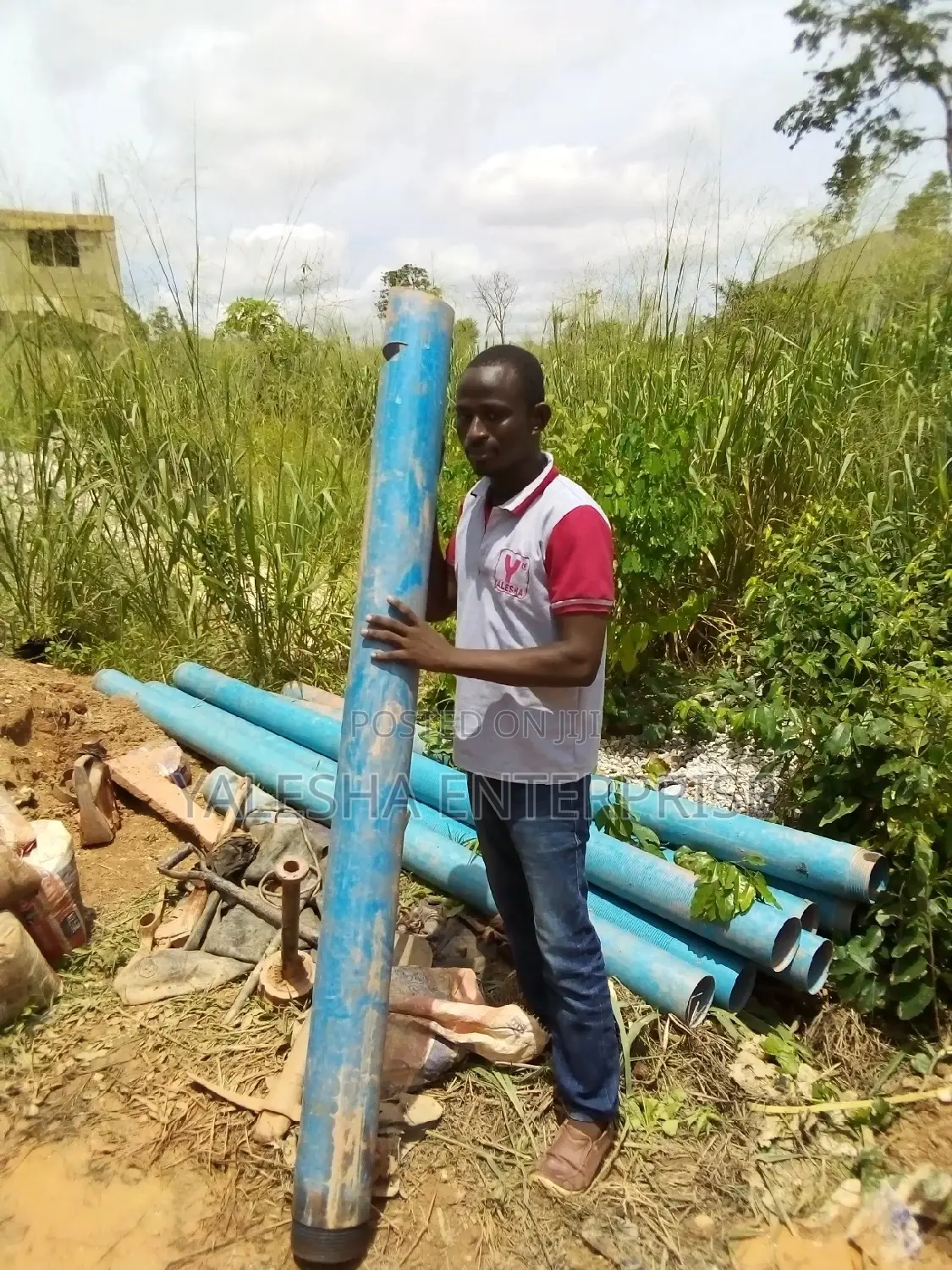 Borehole Drilling Services With Quality Pump and Blue Pipes