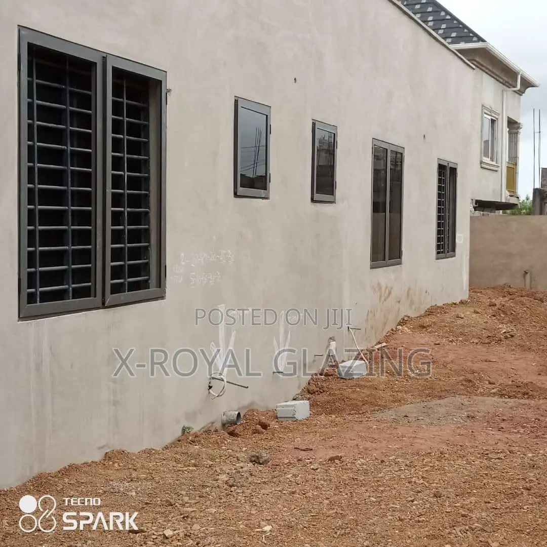 Grey Coating Italian Projected Windows Well Installed