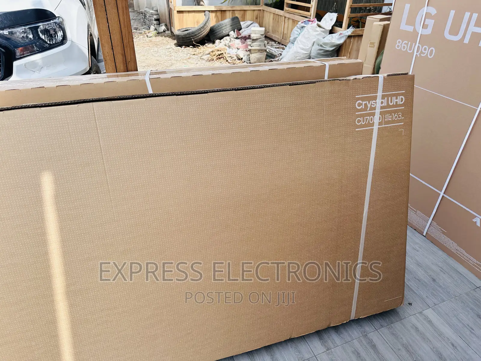 A Glossy Window UHD Smart Samsung 65”Cu8000 Tv
