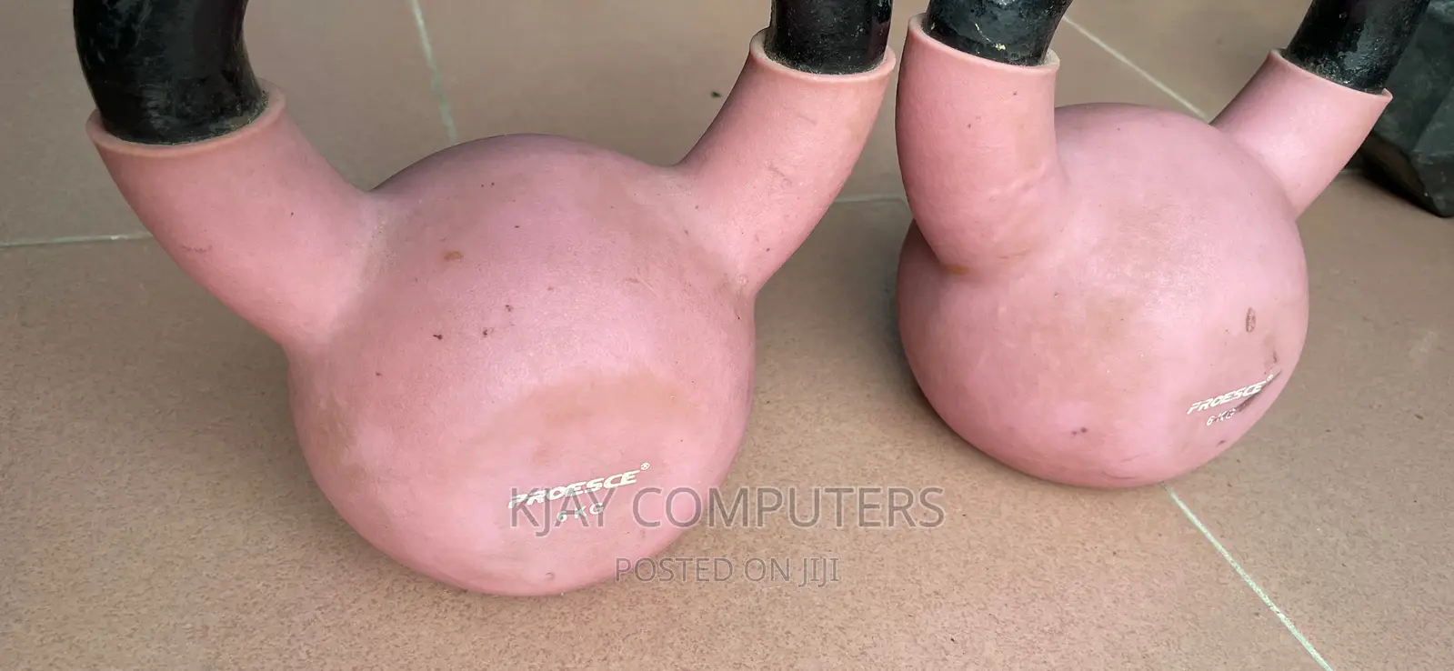 A Pair of 6 Kg Rubber Kettle Bells