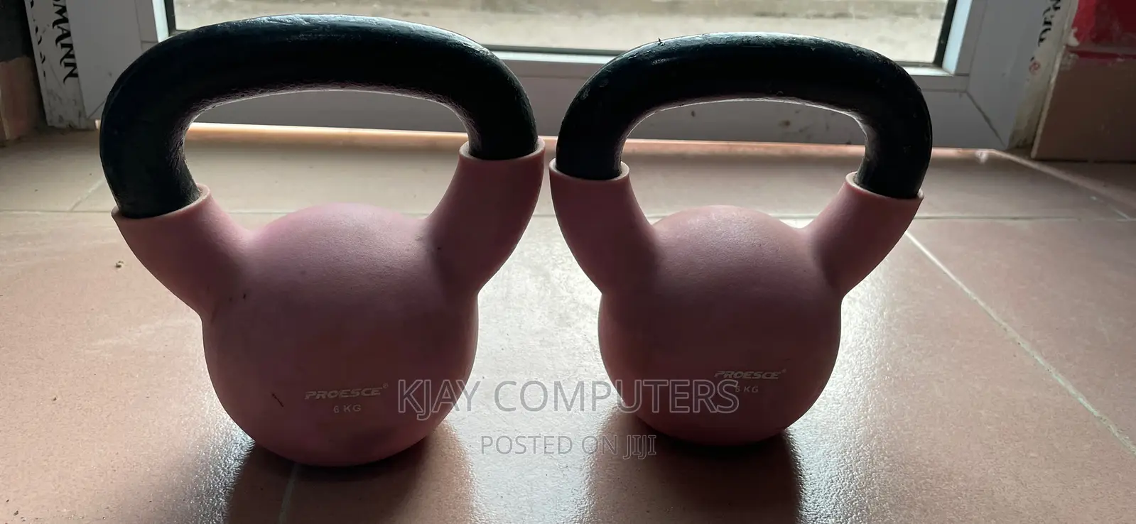 A Pair of 6 Kg Rubber Kettle Bells