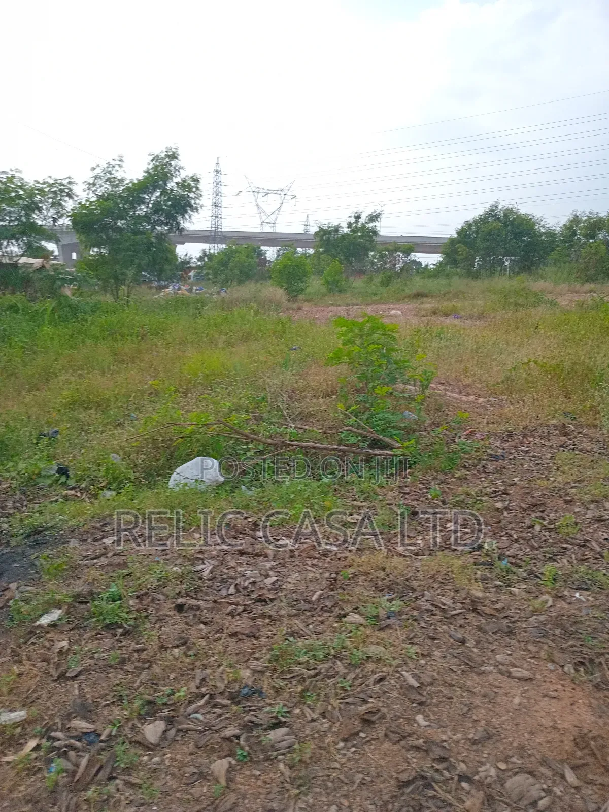 9 Acrs of Land at Pokuase Just by the Road for Sale