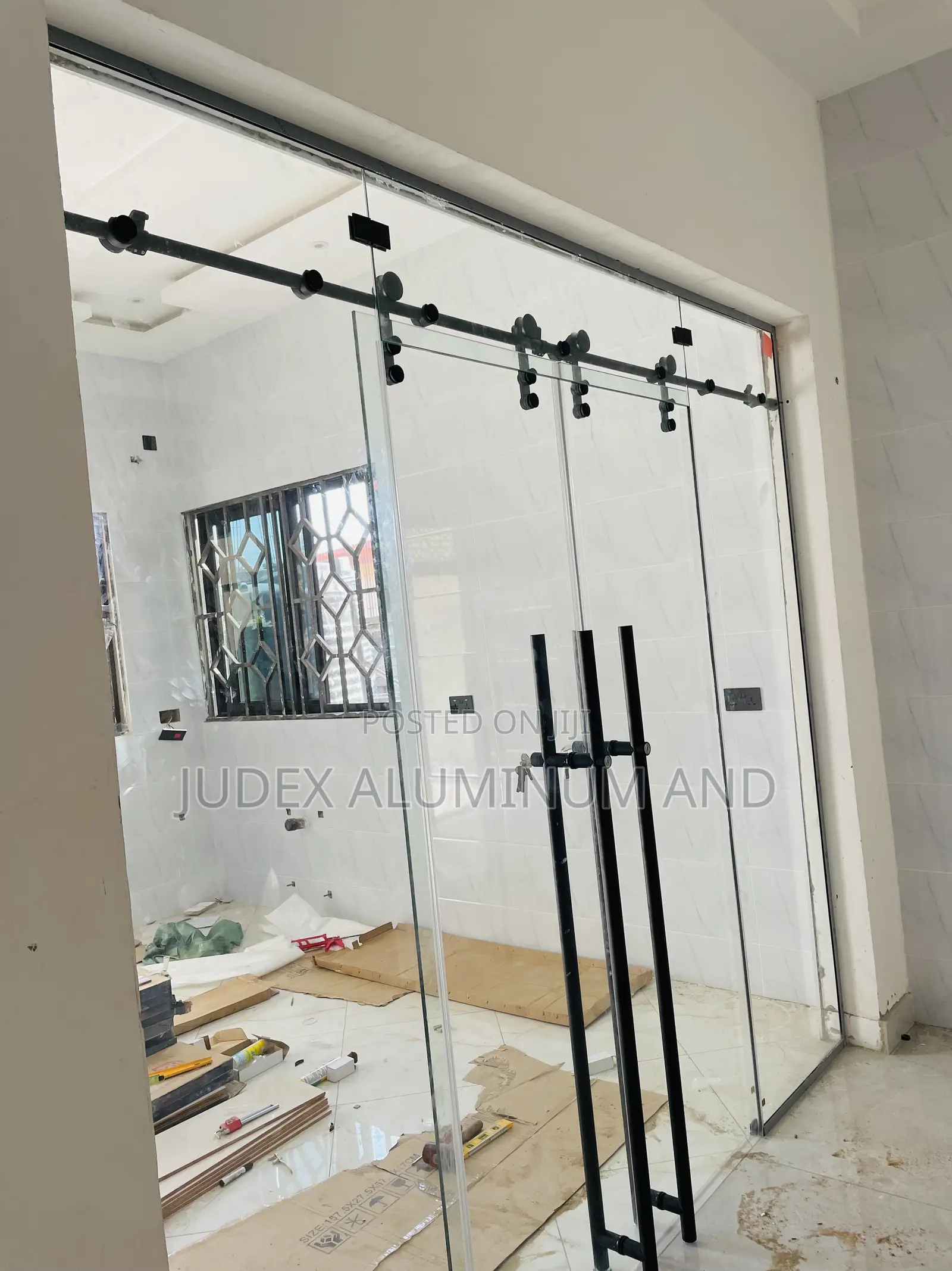 Frameless Double Sliding Doors With Black Accessories