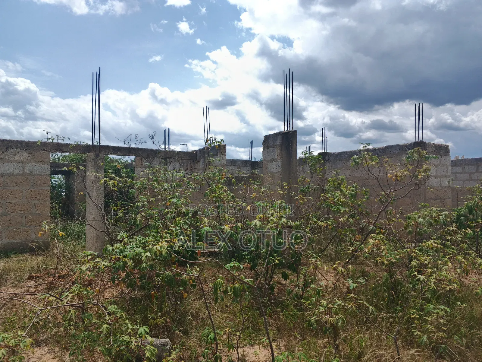 Uncompleted Building Building on Two Plots of Land
