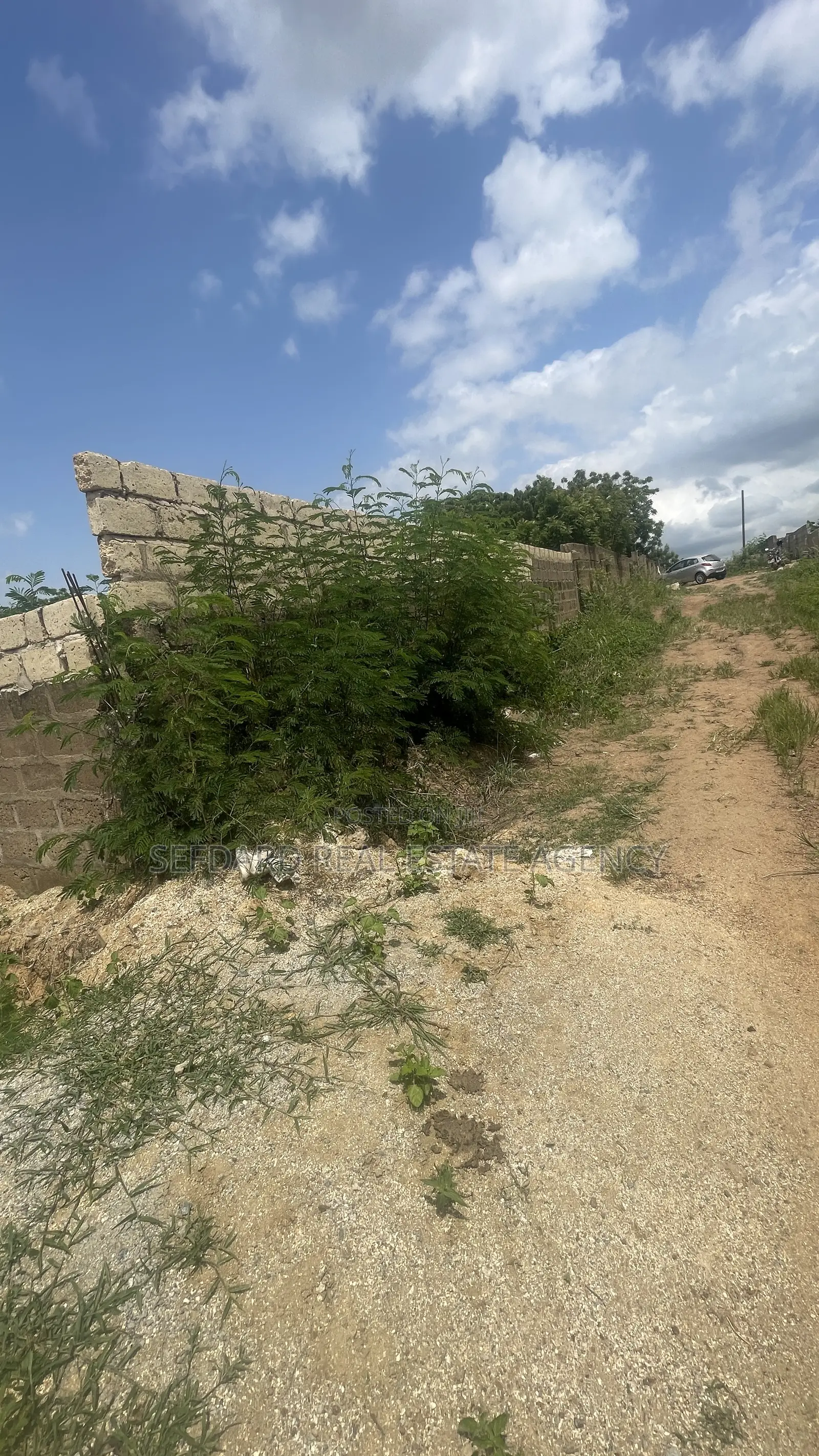 Wall and Gated 4 Plots of Land for Sale at Amasaman .