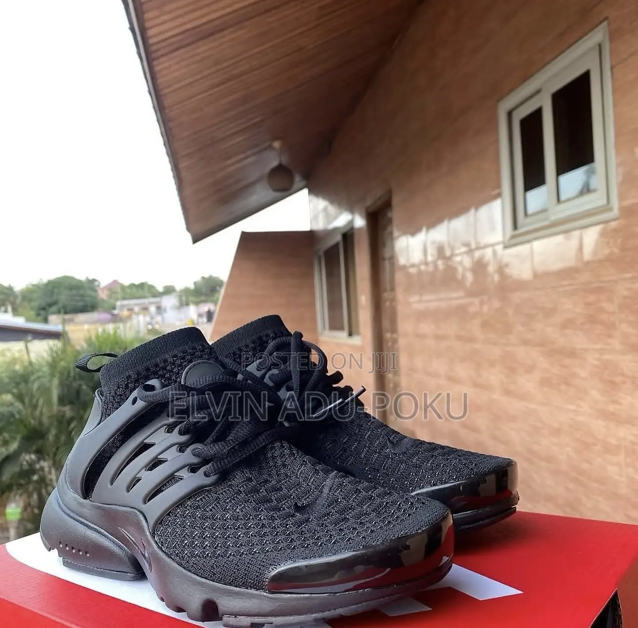 Nike Air Presto "Triple Black" Sneakers.