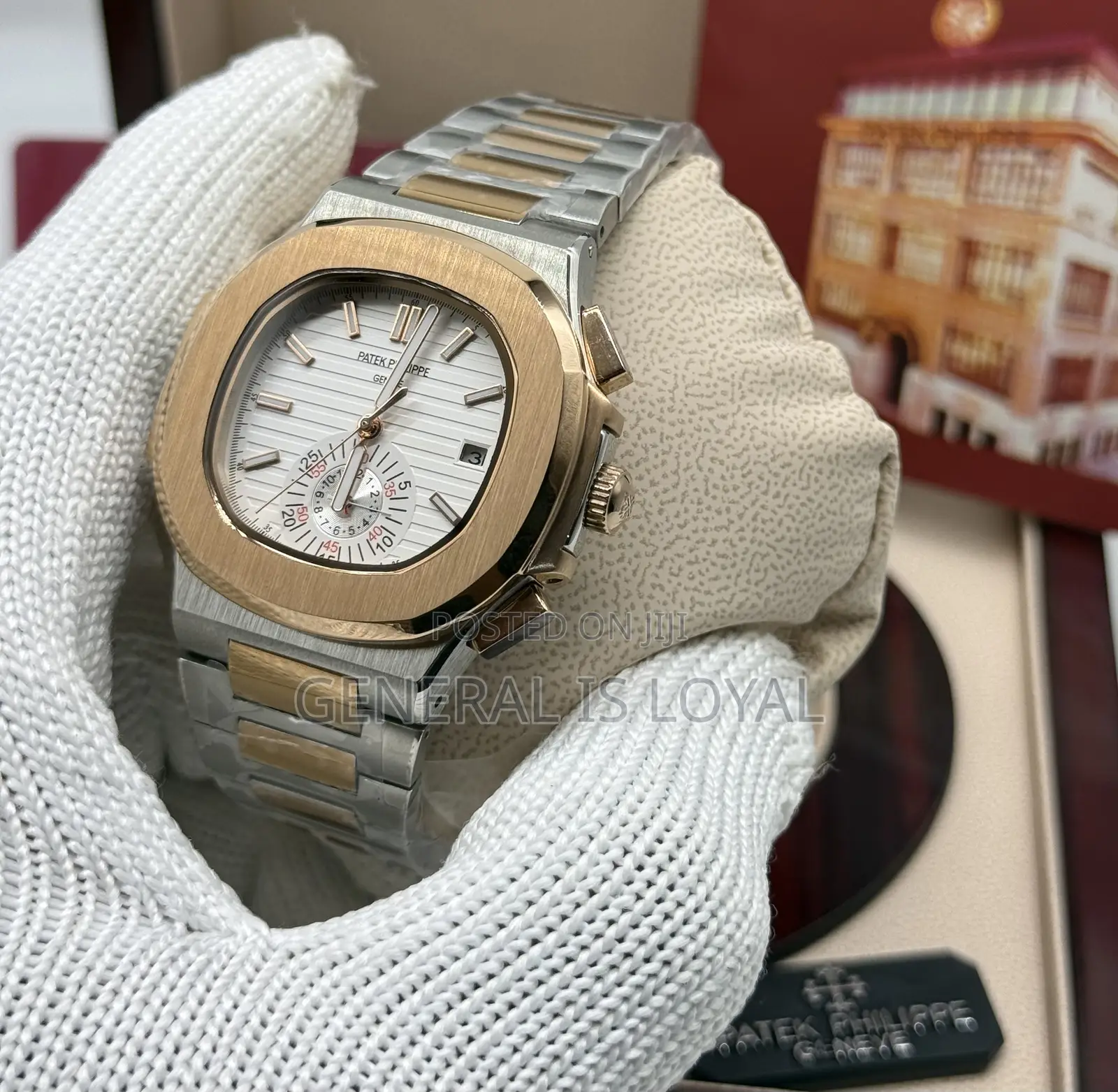 Patek Philippe Two Tone Stainless Steel Nautilus Watch  Black Dial.