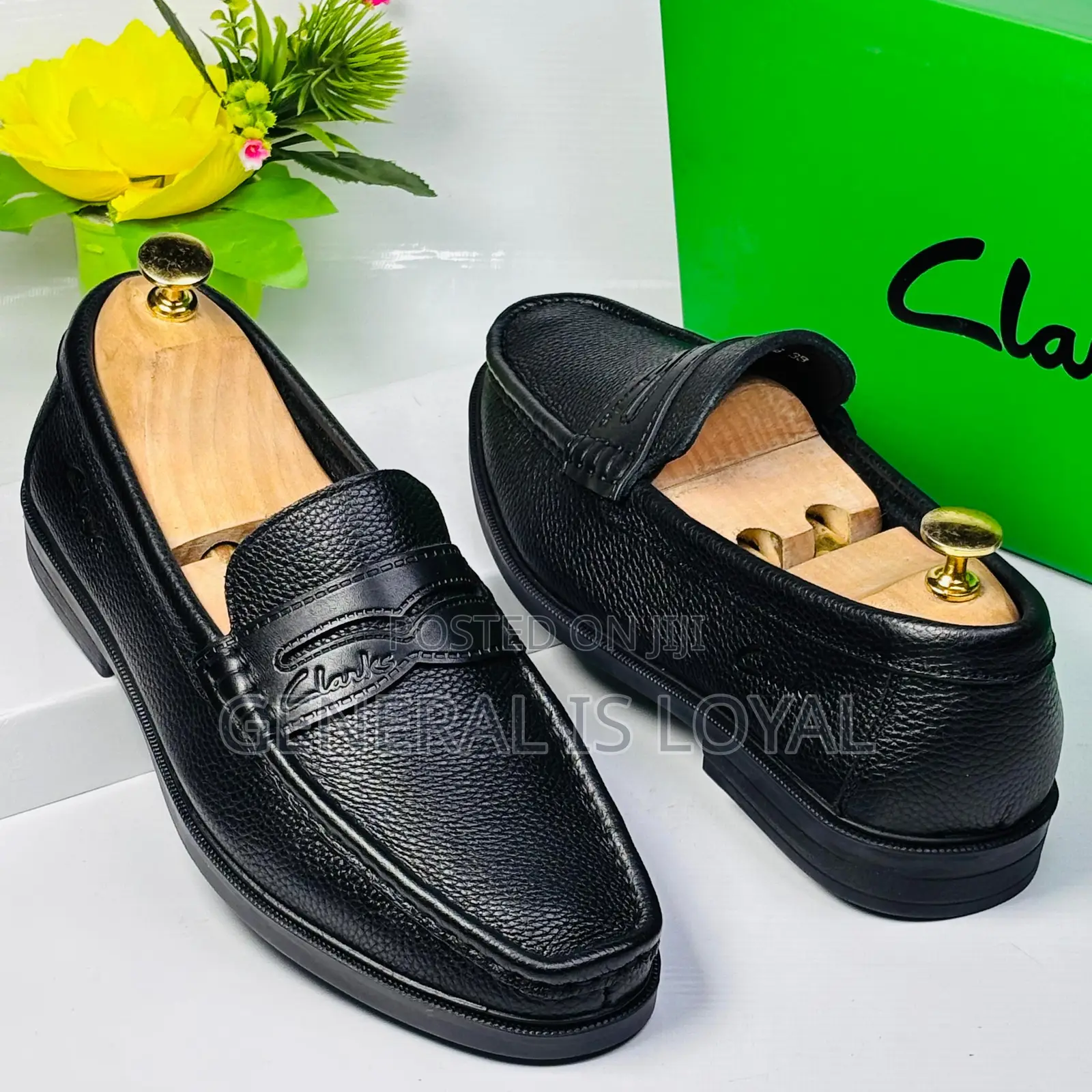 Black Leather Clarks Men's Penny Loafers.
