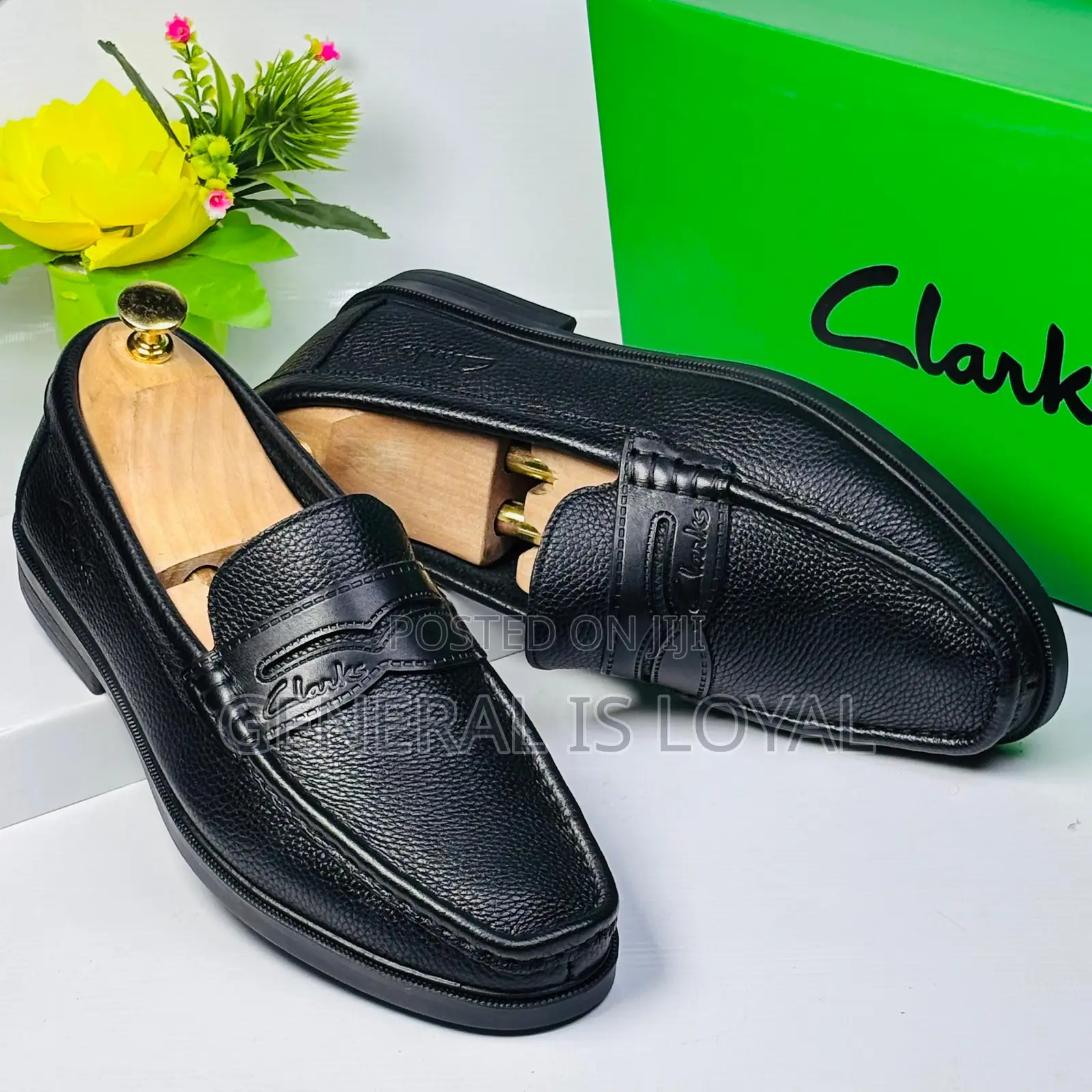 Black Leather Clarks Men's Penny Loafers.