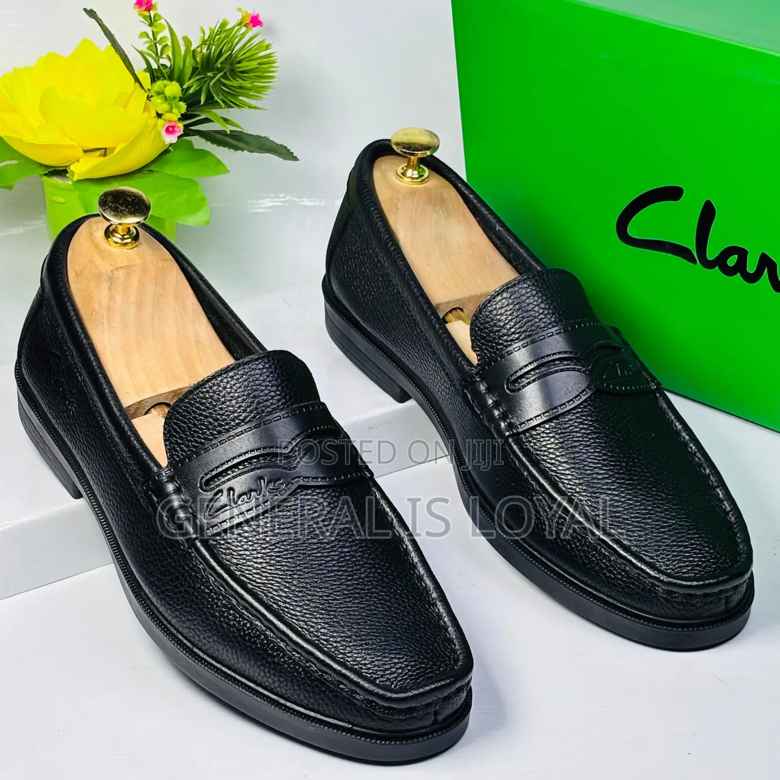 Black Leather Clarks Men's Penny Loafers.
