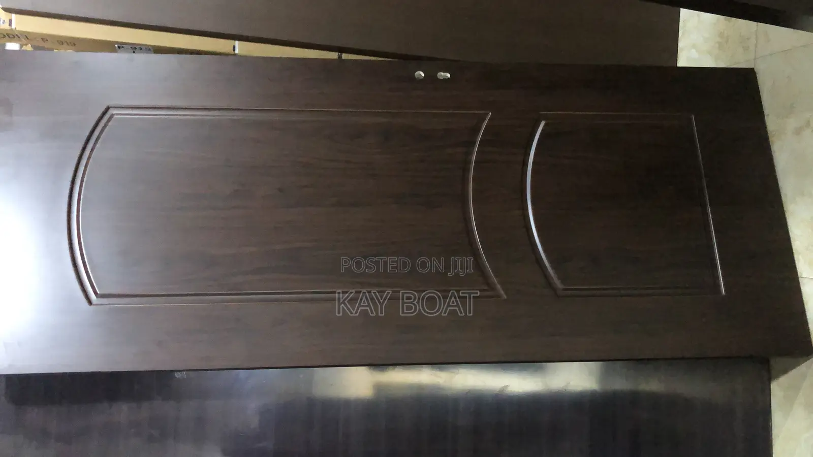 A Brown Like Fully Wooden Door With All Accessories