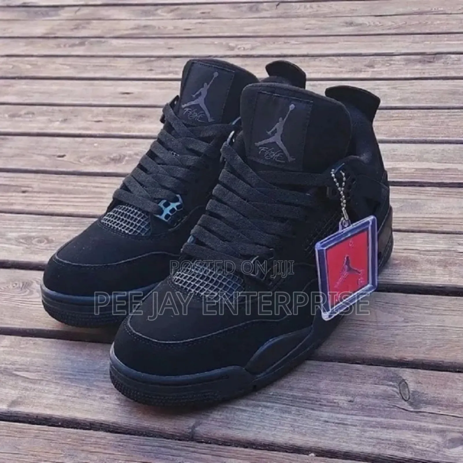 Air Jordan 4 Retro "Black Cat" Sneakers.