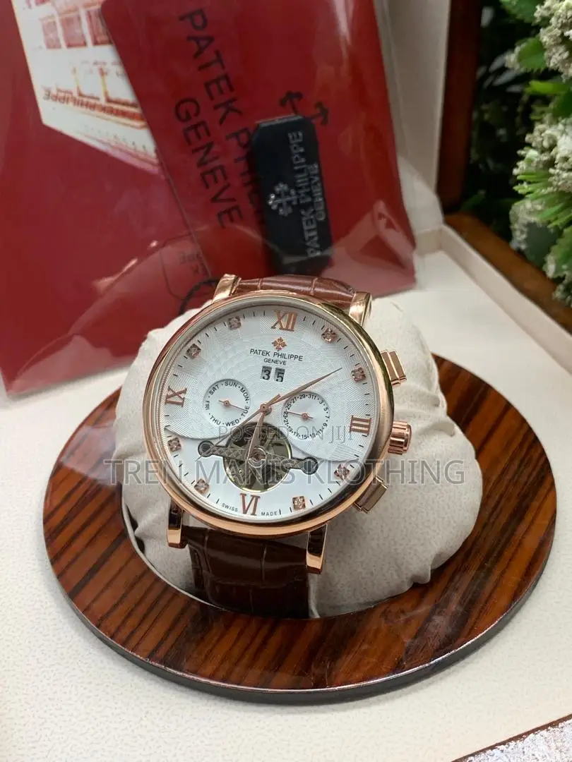 Gold Brown Leather Patek Philippe Automatic Watch White Surface
