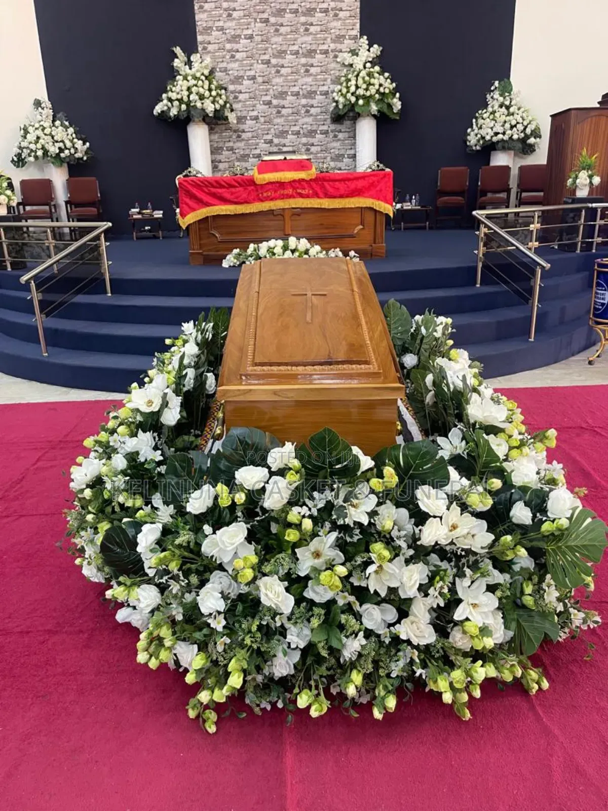 Beautiful Floral Arrangements Around Casket/Coffin