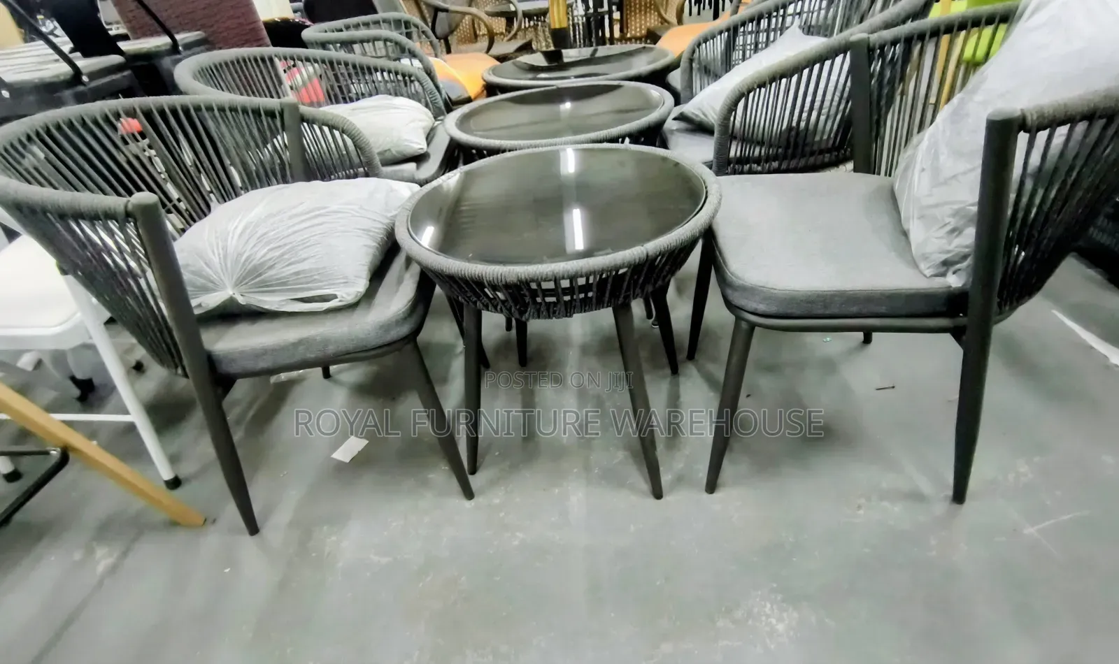 Rope-Woven Armchairs and a Round Bistro Table With Tempered Glass Top.