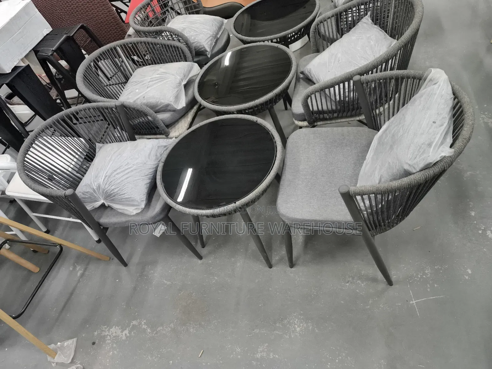 Rope-Woven Armchairs and a Round Bistro Table With Tempered Glass Top.