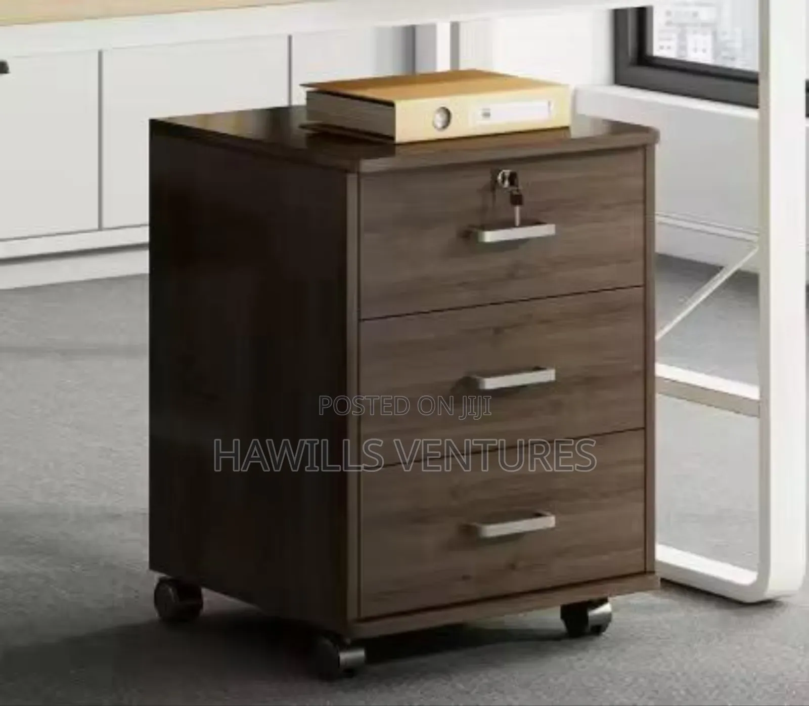 3 - Drawer Mobile File Cabinet Featuring a Dark Wood Finish.