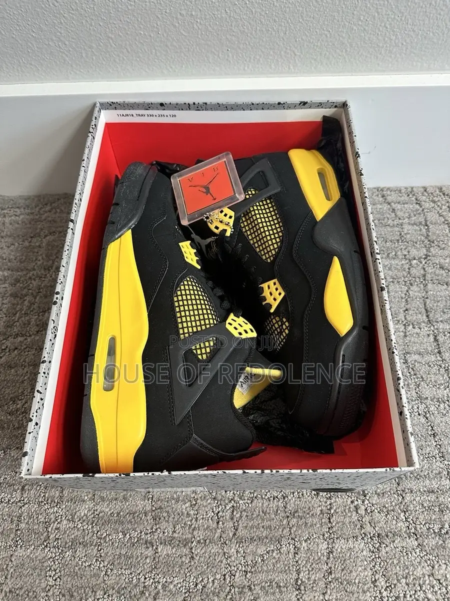 Air Jordan 4 Retro Thunder Sneakers in Yellow and Black Colorway