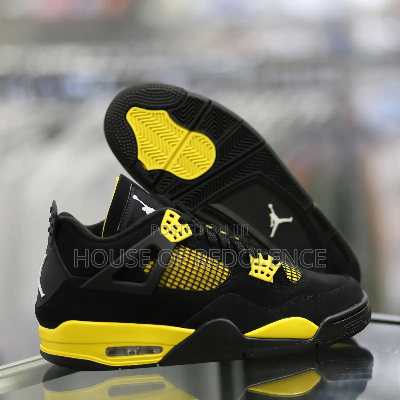 Air Jordan 4 Retro Thunder Sneakers in Yellow and Black Colorway