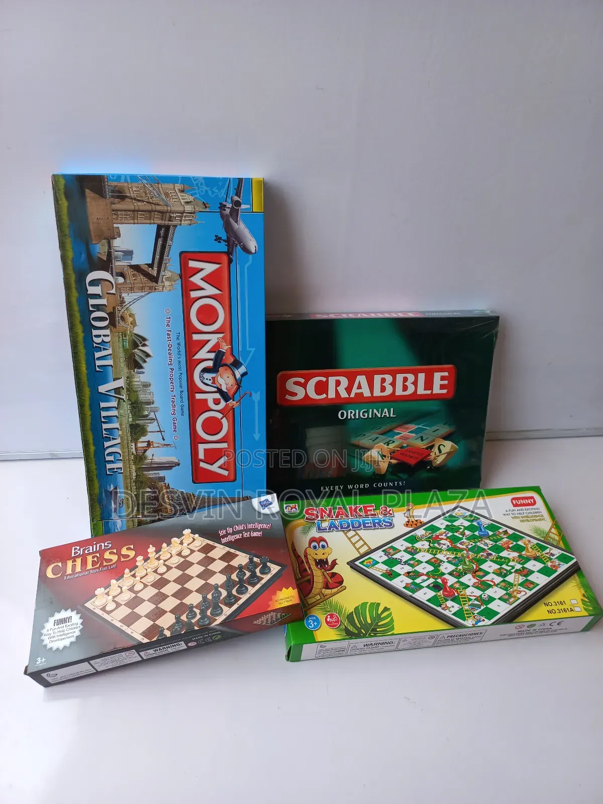 Scrabble + Monopoly + Chess + Snake and Ladders