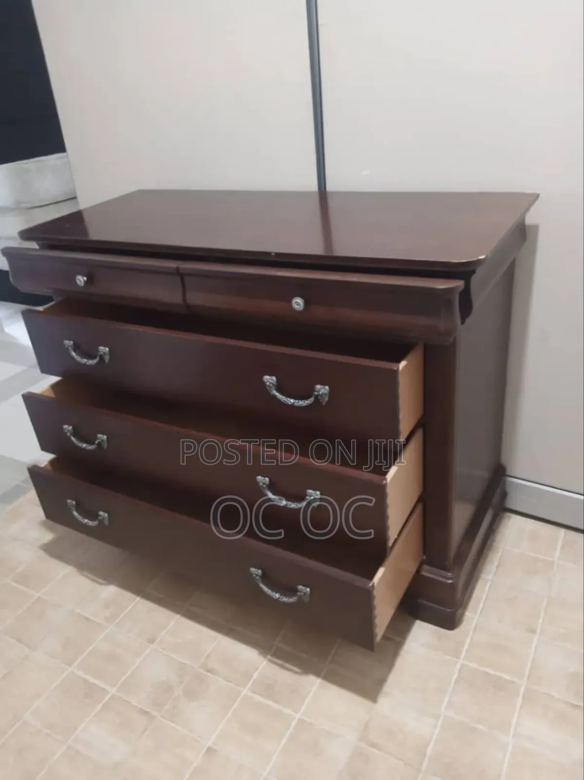 Dark Wood Dresser Features Decorative Silver Handles