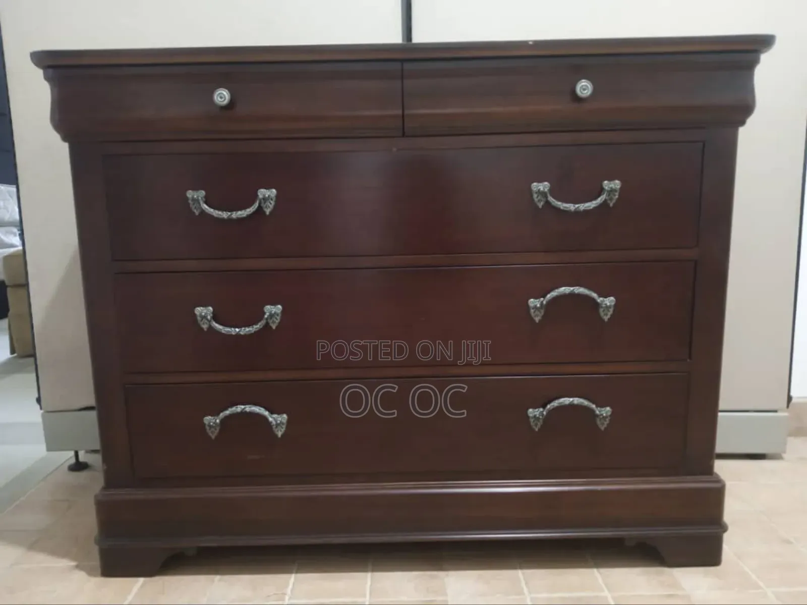Dark Wood Dresser Features Decorative Silver Handles