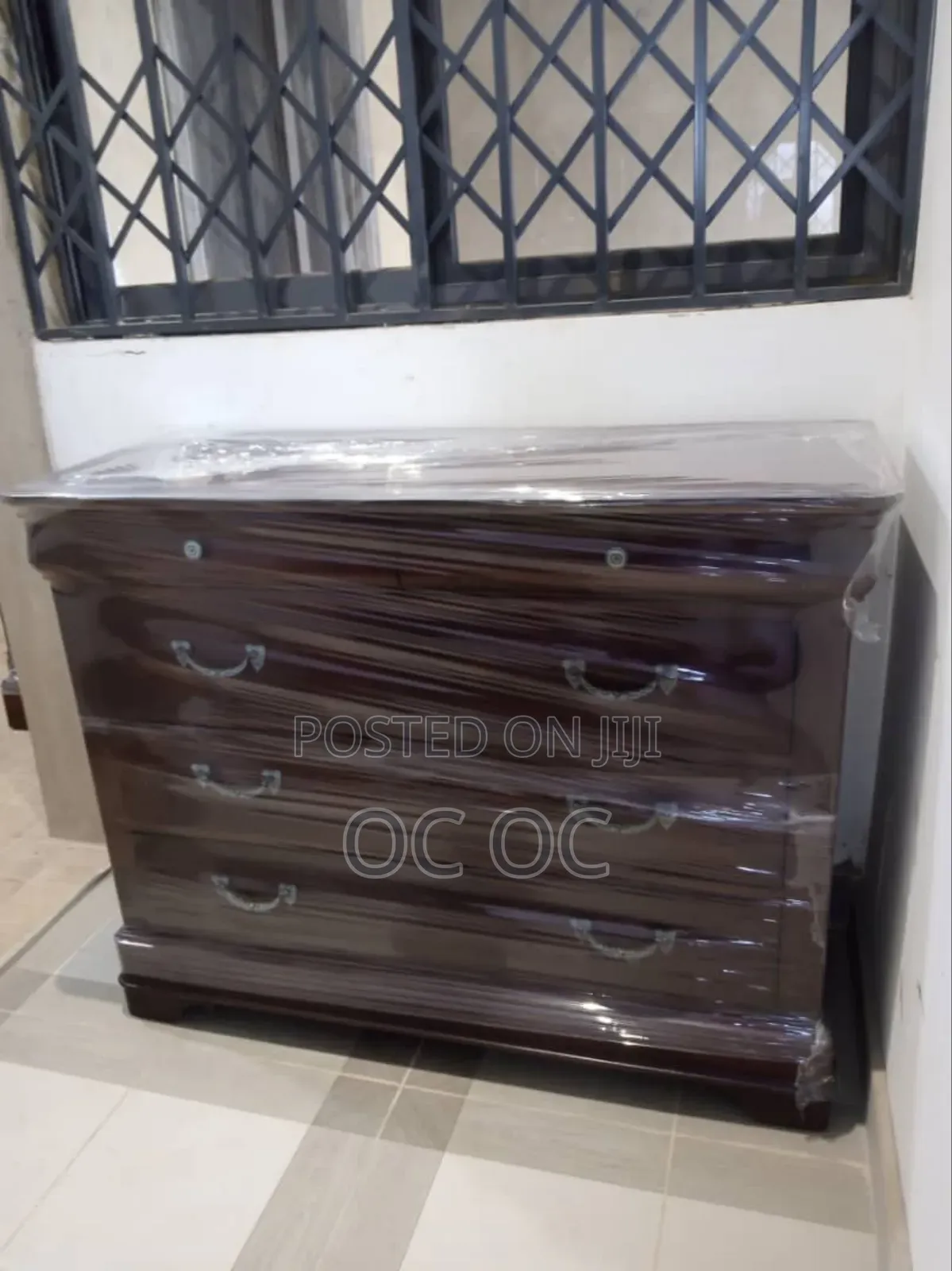Dark Wood Dresser Features Decorative Silver Handles