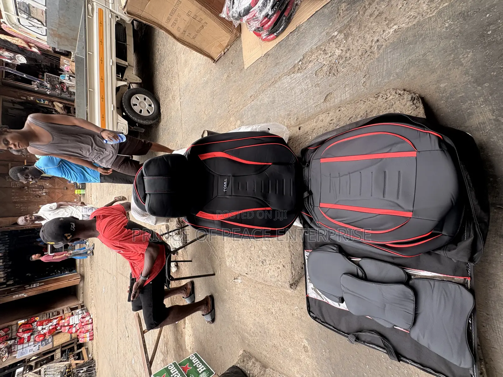 Two Front Leather Seat Covers With Black and Red Design