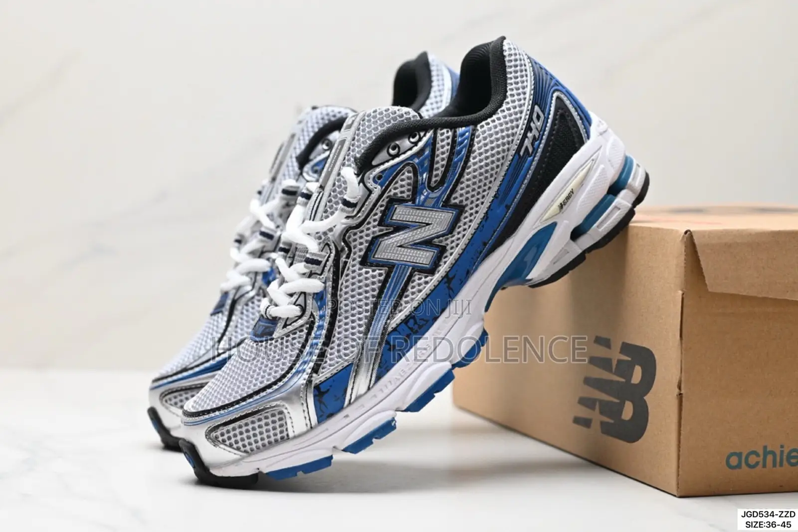 New Balance 740 in White Blue Colorway Sneakers
