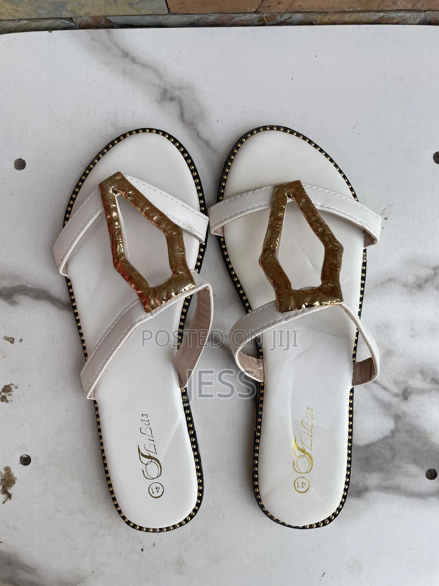 White, Faux Leather Slipper With Metallic Keyhole Design
