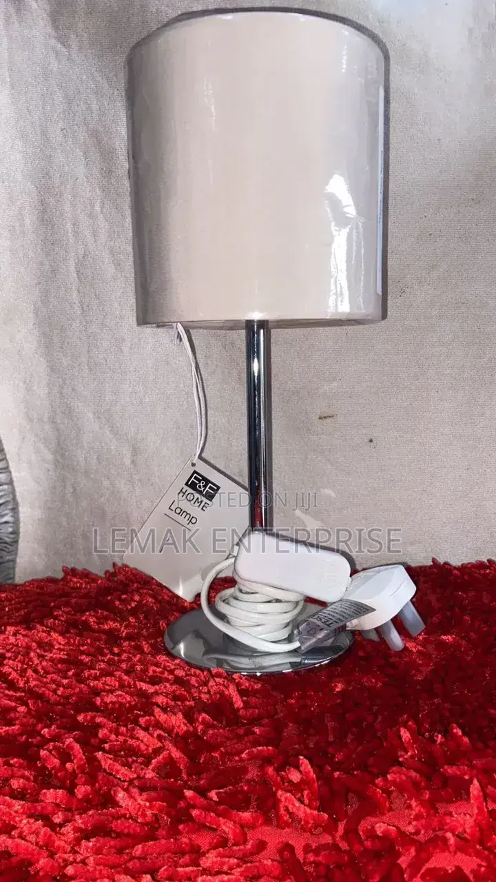 Modern Chrome Table Lamp With Glossy White Drum Shade.