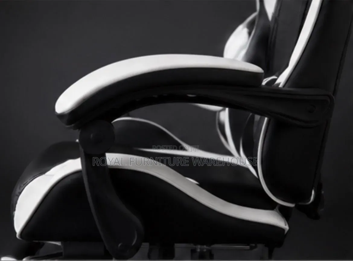 Black/White Ergonomic Gaming Chair With Footrest and Headrest Pillow.