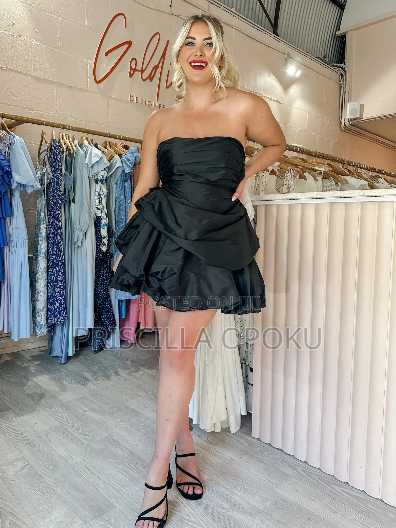 Mini Dress Features a Distinctive Tiered Ra-Ra Skirt A