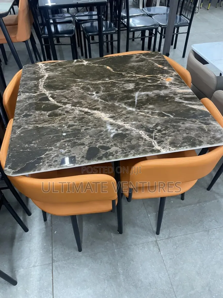 Modern 4-Seater Black Marble Dining Set With Orange Chairs